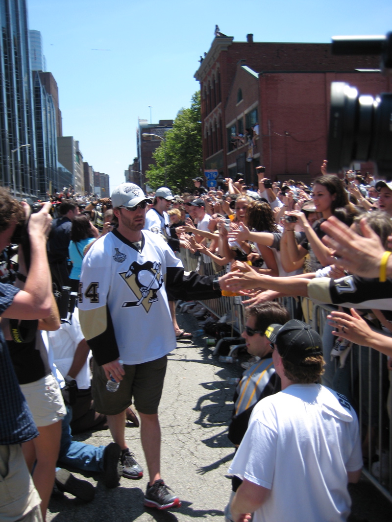 He needs the sunglasses to protect the public from the laser eyes.